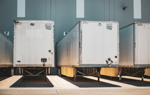 Trailers backed into dock doors at a distribution center